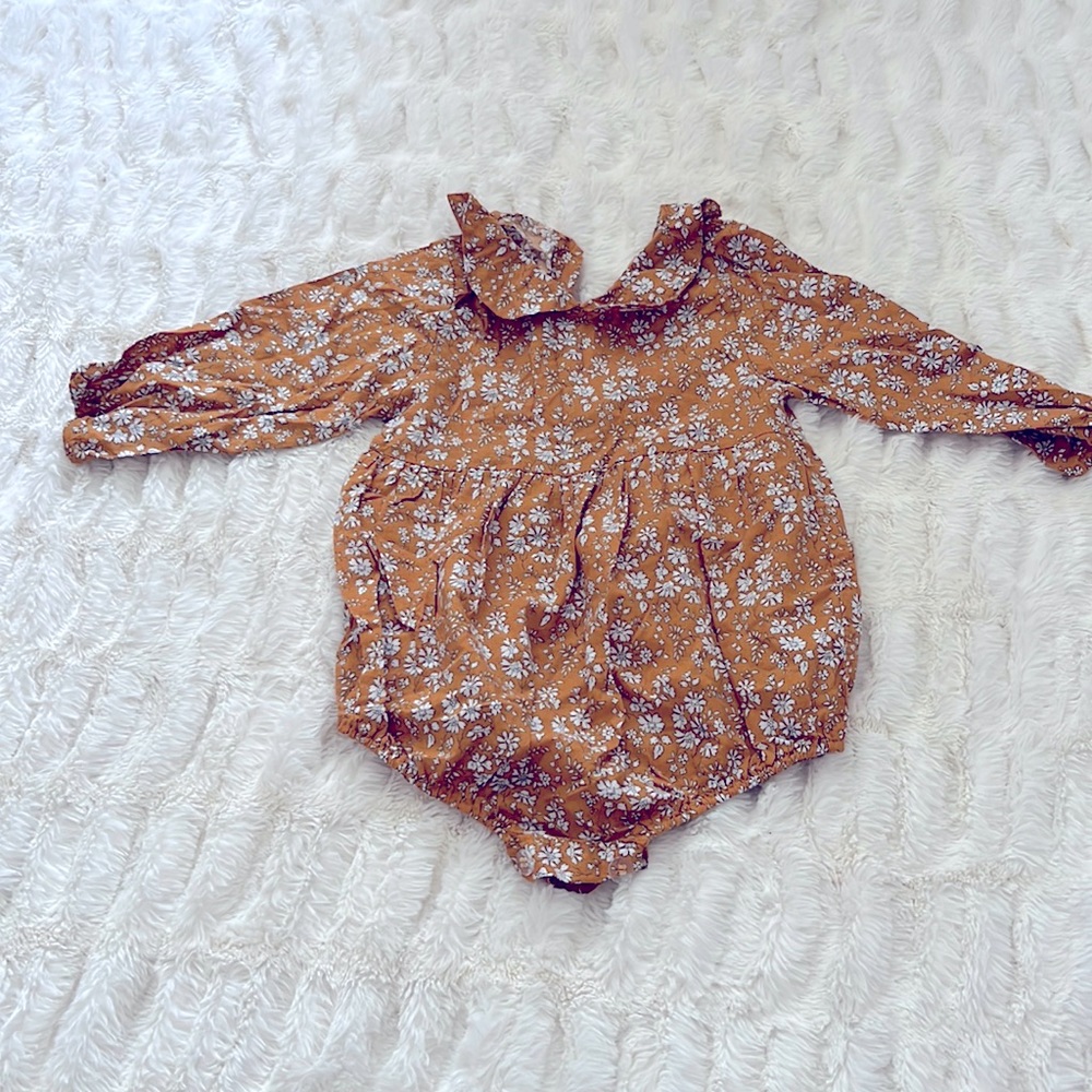 Baby girl bubble romper size 6-9 months.